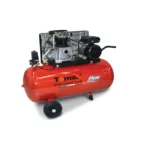 Red Tomax Fiac air compressor with black motor and wheels, designed for professional tools.