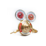 Brass acetylene gas regulator with dual pressure gauges and control valve for welding applications.